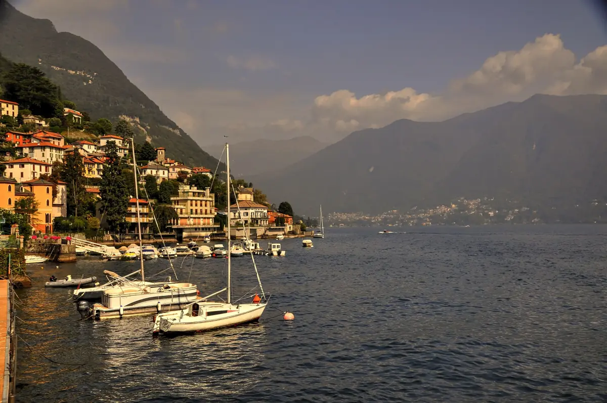 Boats in a lakeside village at sunset